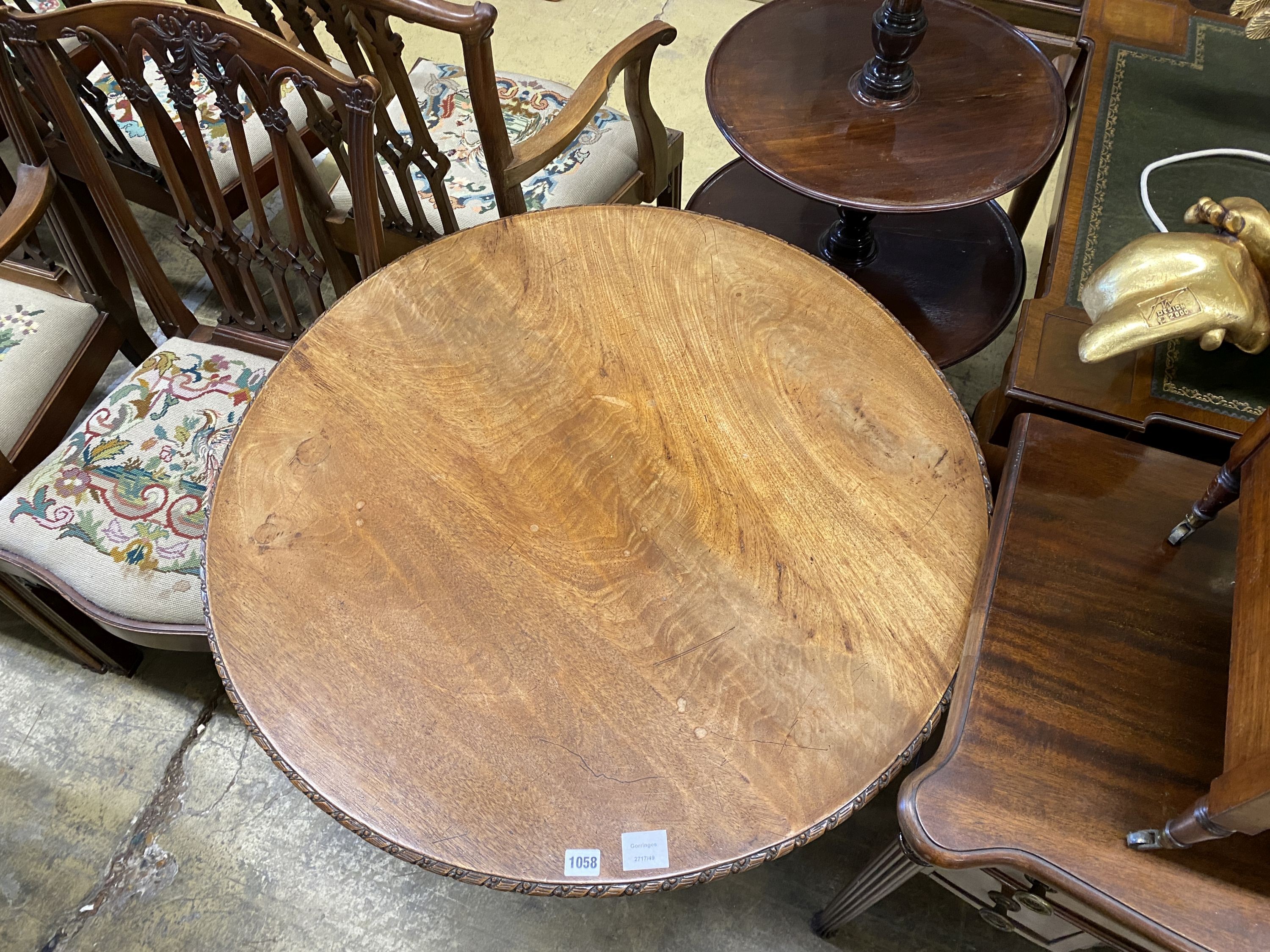 A George III carved circular mahogany tilt top tea table, diameter 88cm, height 71cm